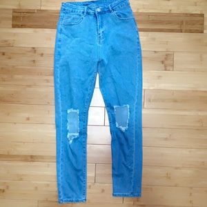 High waisted light blue ripped jeans